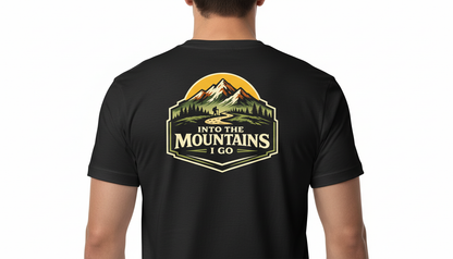 Black t-shirt with 'Into the Mountains I Go' design on the back, worn by a person.