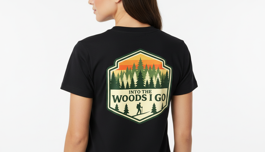 Black t-shirt with 'Into the Woods I Go' graphic on the back, worn by a person.