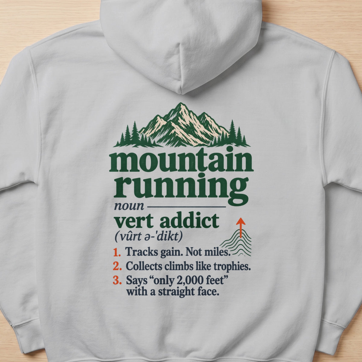 Graphic design on hoodie: "mountain running" definition and mountain imagery.