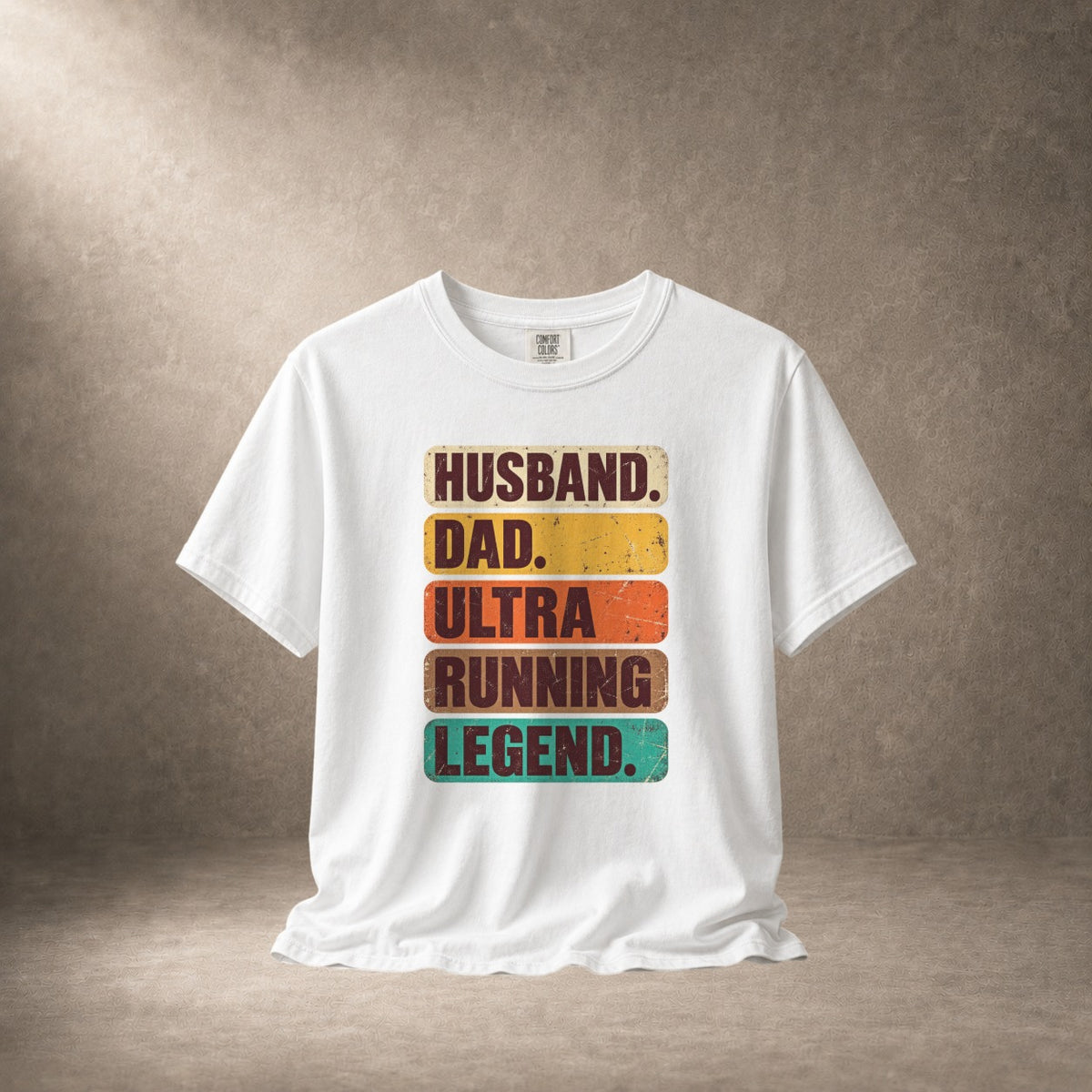 White t-shirt with text "HUSBAND. DAD. ULTRA RUNNING LEGEND."