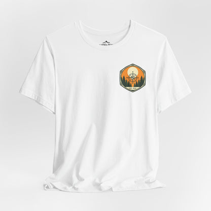 White t-shirt with a graphic design on a light gray background