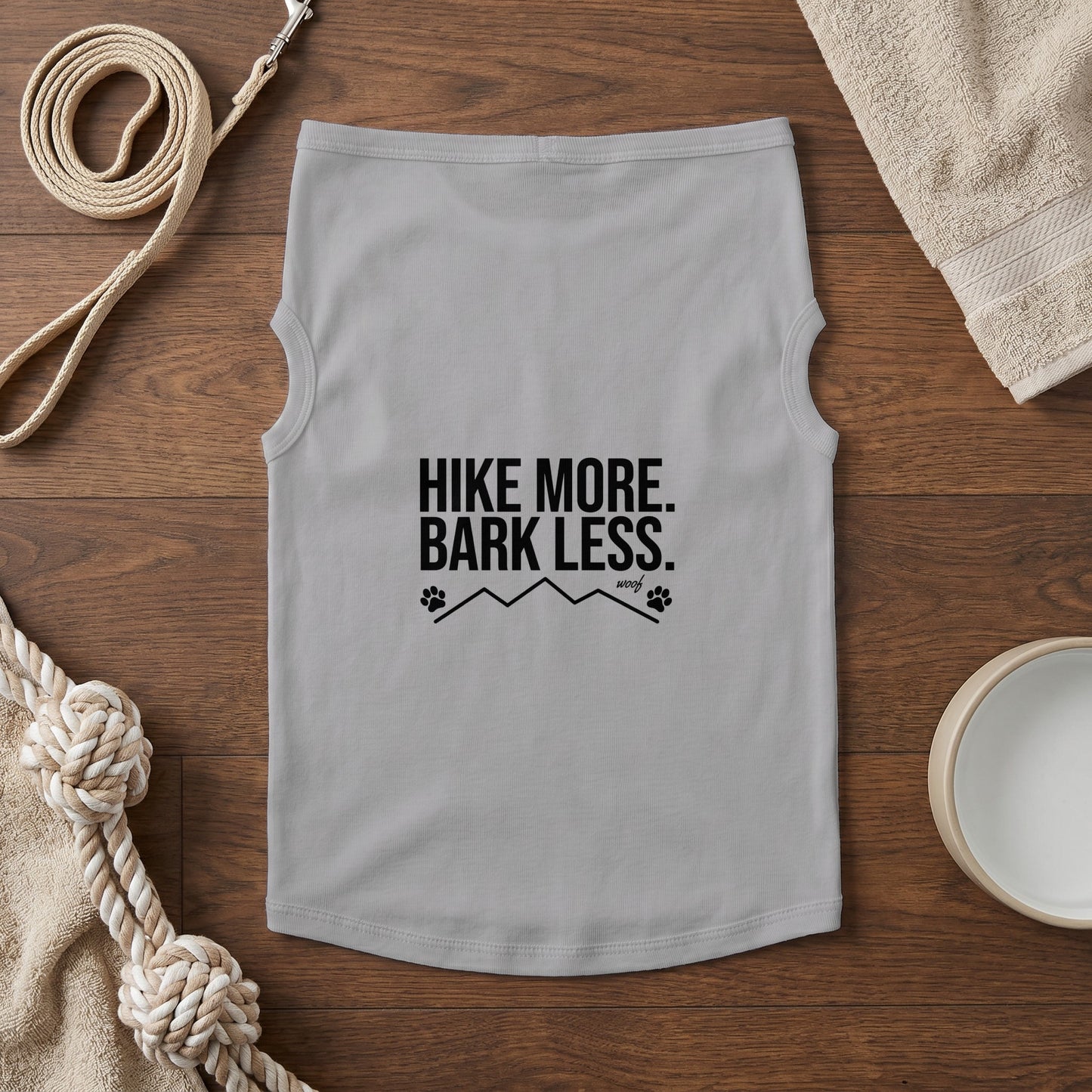 Light gray dog shirt with "HIKE MORE. BARK LESS." text and mountain graphic.
