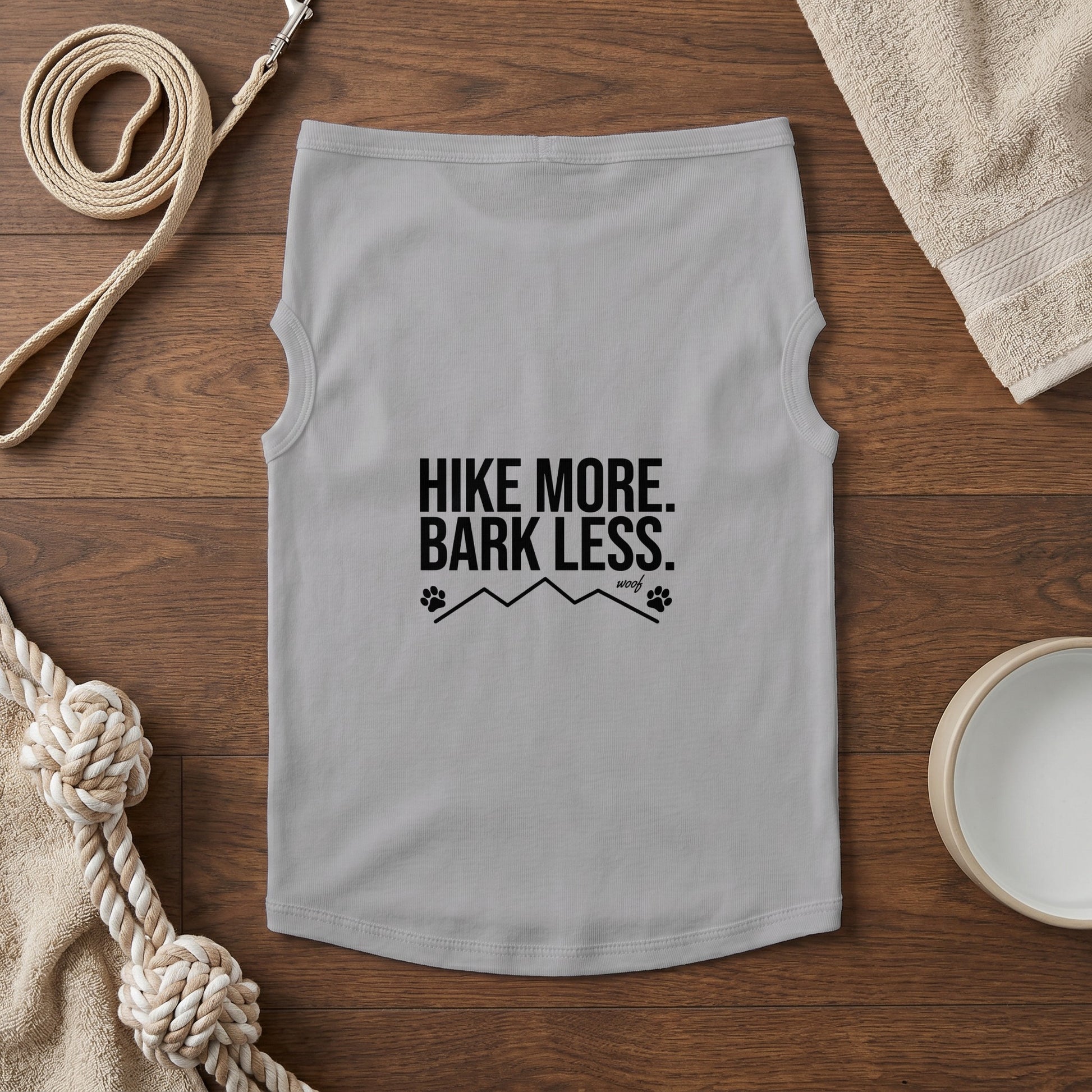 Light gray dog shirt with "HIKE MORE. BARK LESS." text and mountain graphic.