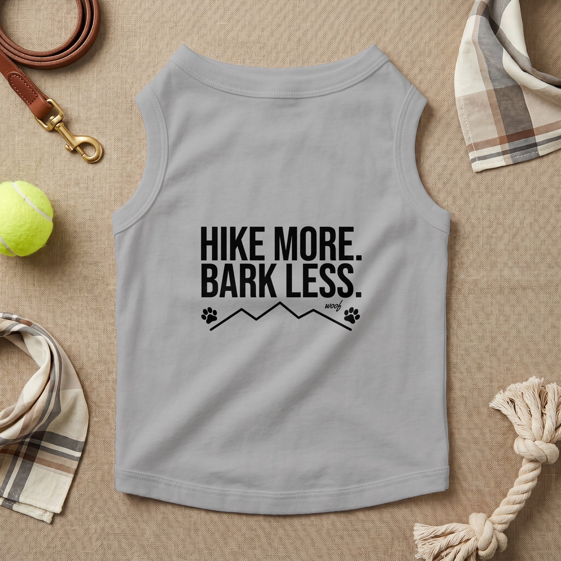 Gray dog shirt with "Hike More. Bark Less." text and paw prints.