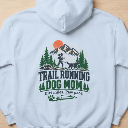 White hoodie with "TRAIL RUNNING DOG MOM" graphic and running woman with dog.