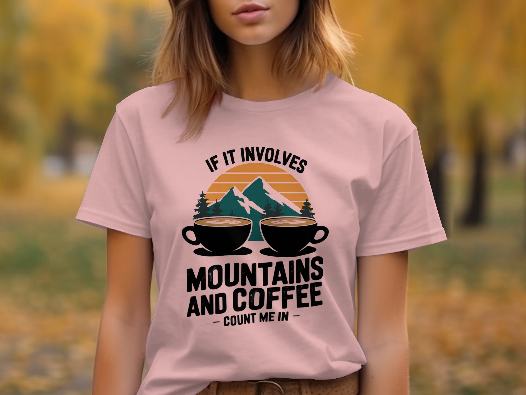 If It Involves Mountains and Coffee Count Me In light pink shirt