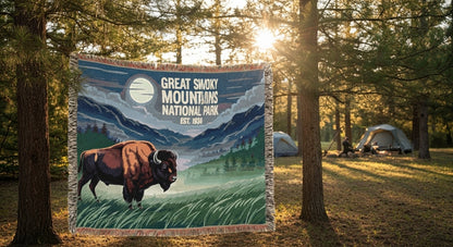 Blanket with Great Smoky Mountains National Park design featuring a bison and mountains, displayed outdoors.