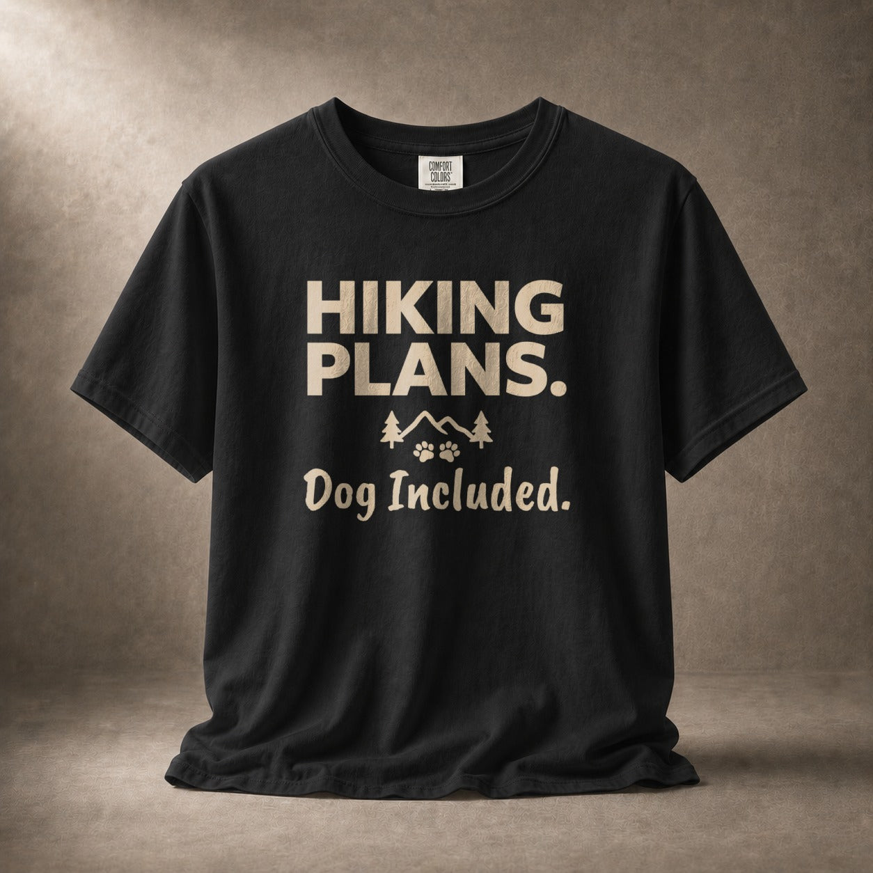 Black t-shirt with "Hiking Plans. Dog Included." text and mountain graphic.