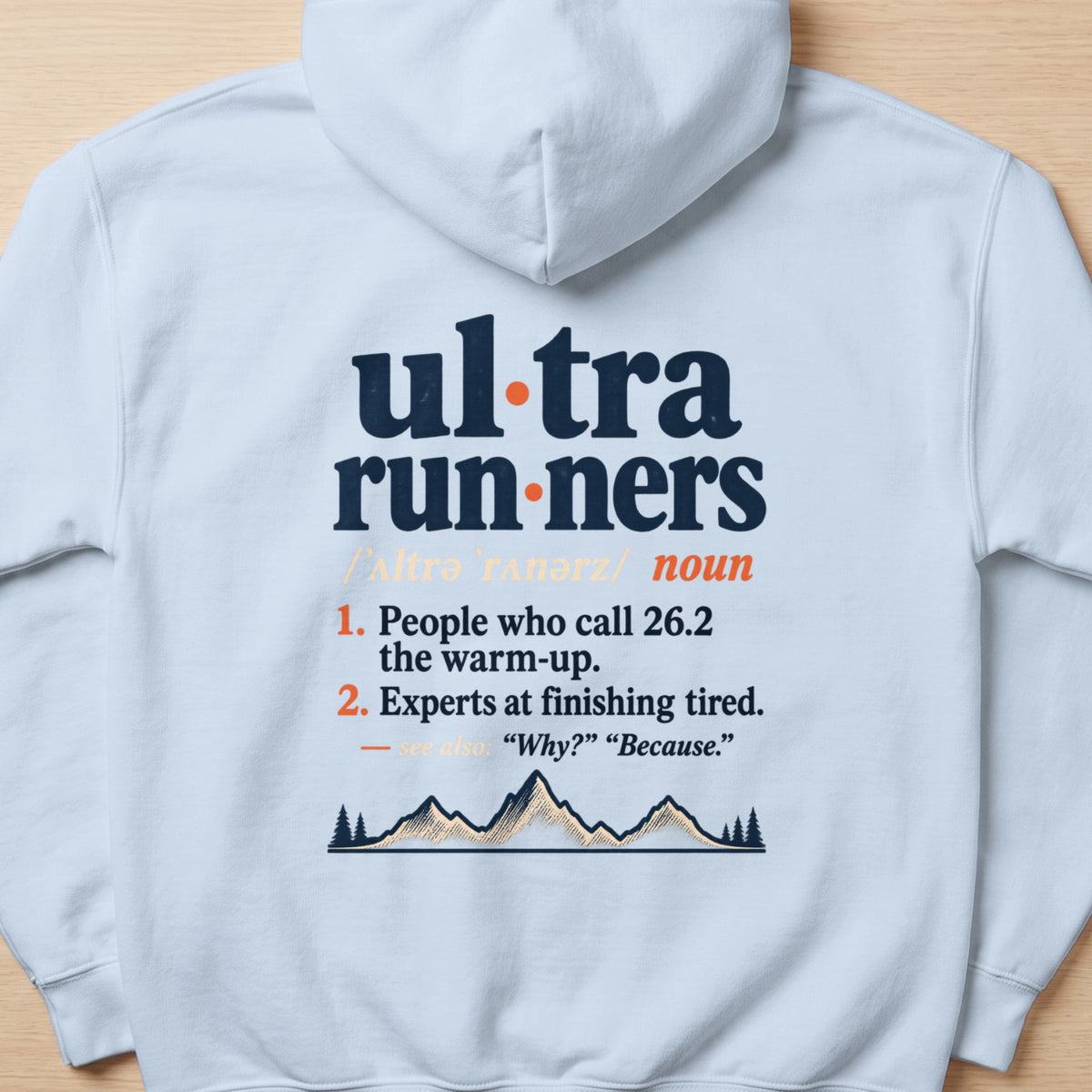 White hoodie with text defining "ultra runners" and a mountain graphic.