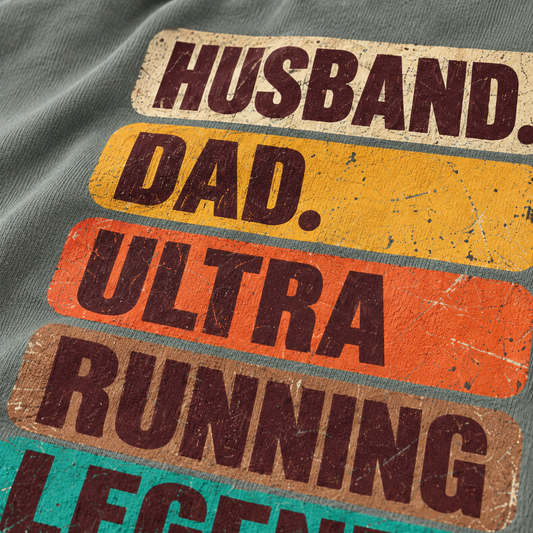 Husband, Dad, Ultra Running Legend text on a gray shirt.