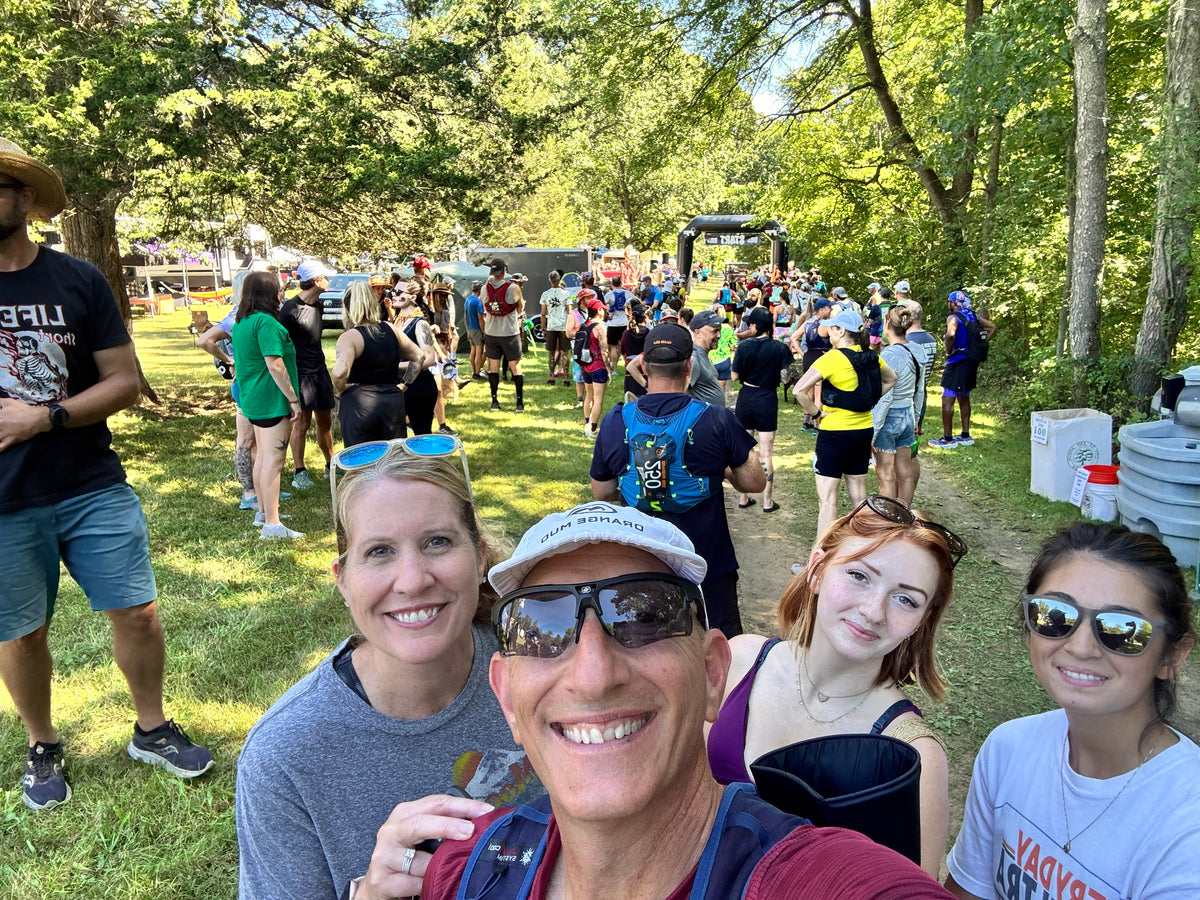 Sloth & Duck founders Scott and Laura with team members Kenna and Rachel at a trail race start