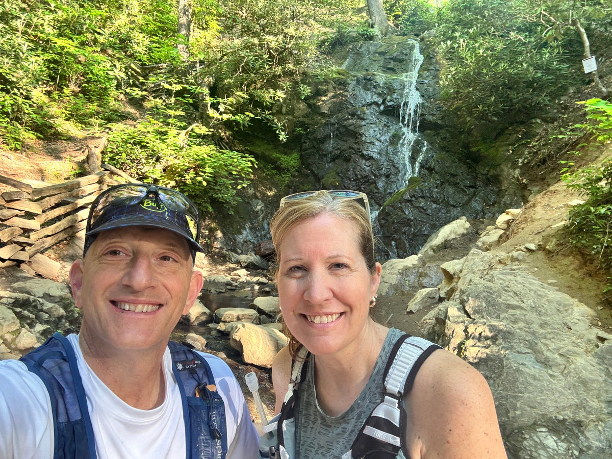 Sloth & Duck founders Scott and Laura on a waterfall trail run